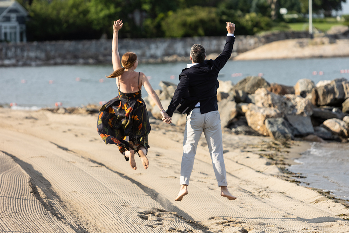 A great engagement session with a happy bride and groom at Westchester Country Club beach on Long Island Sound in Rye New York