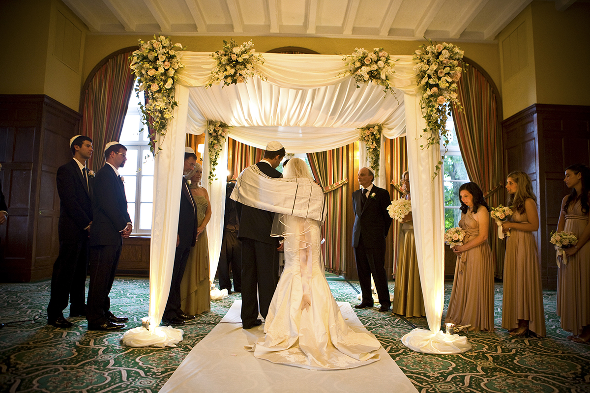Peter oberc wedding photography capturing the magic under the chuppah of a Jewish wedding ceremony at Westchester country club in Westchester County NY