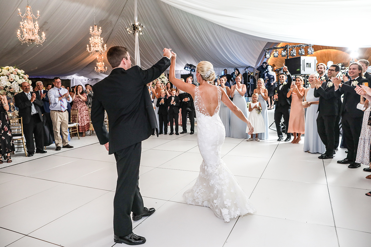 Photojournalistic candid wedding photo of a bride and groom first dance at Westchester Country Club in Rye Westchester County New York tent wedding by Peter Oberc Wedding Photography