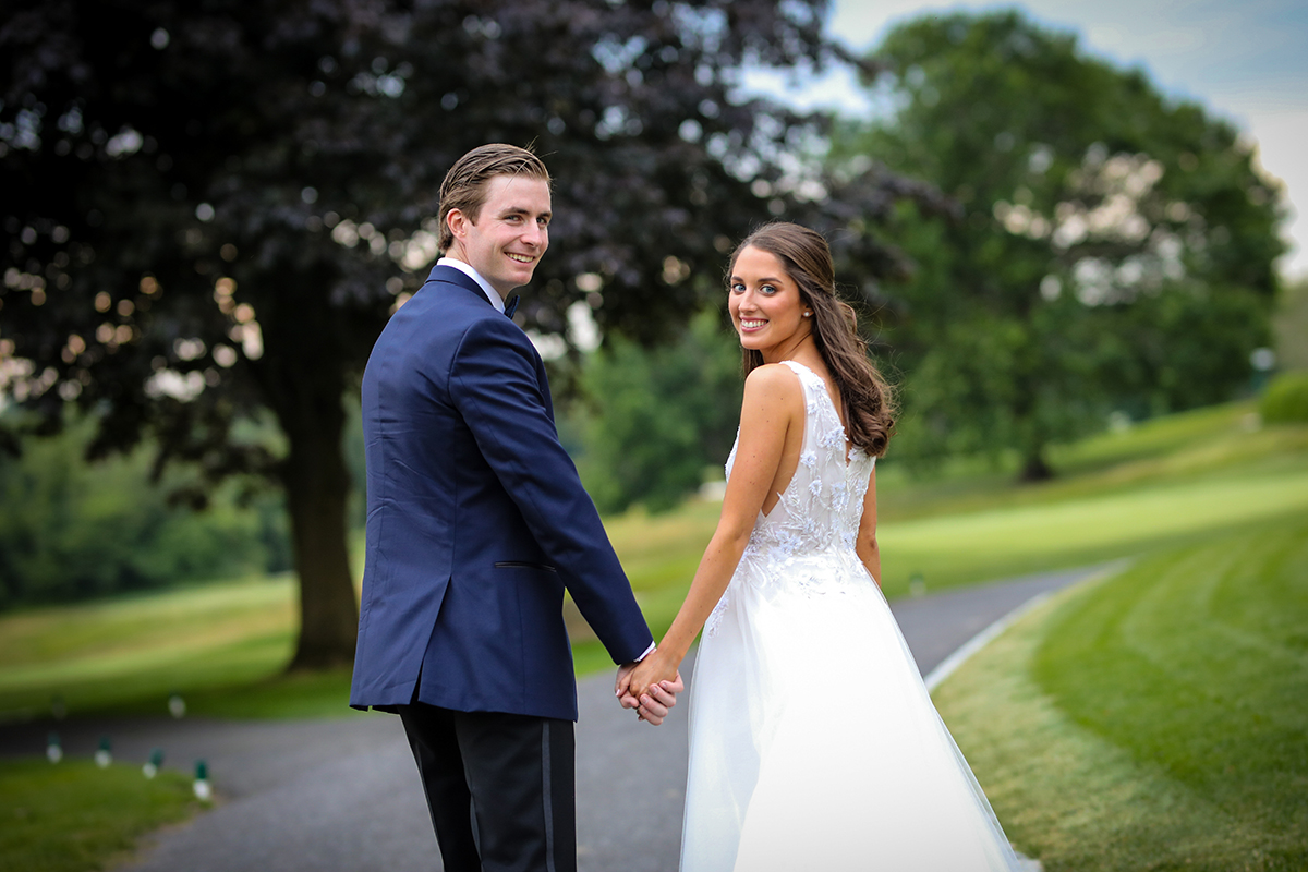 A Beautiful bride and groom image walking away candidly at Westchester Country Club Rye Westchester County New York