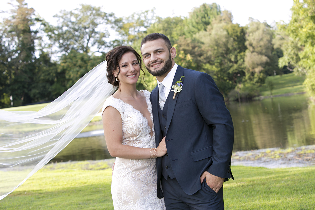 A classic wedding couple portrait of bride and groom at golf club in Westchester County New York