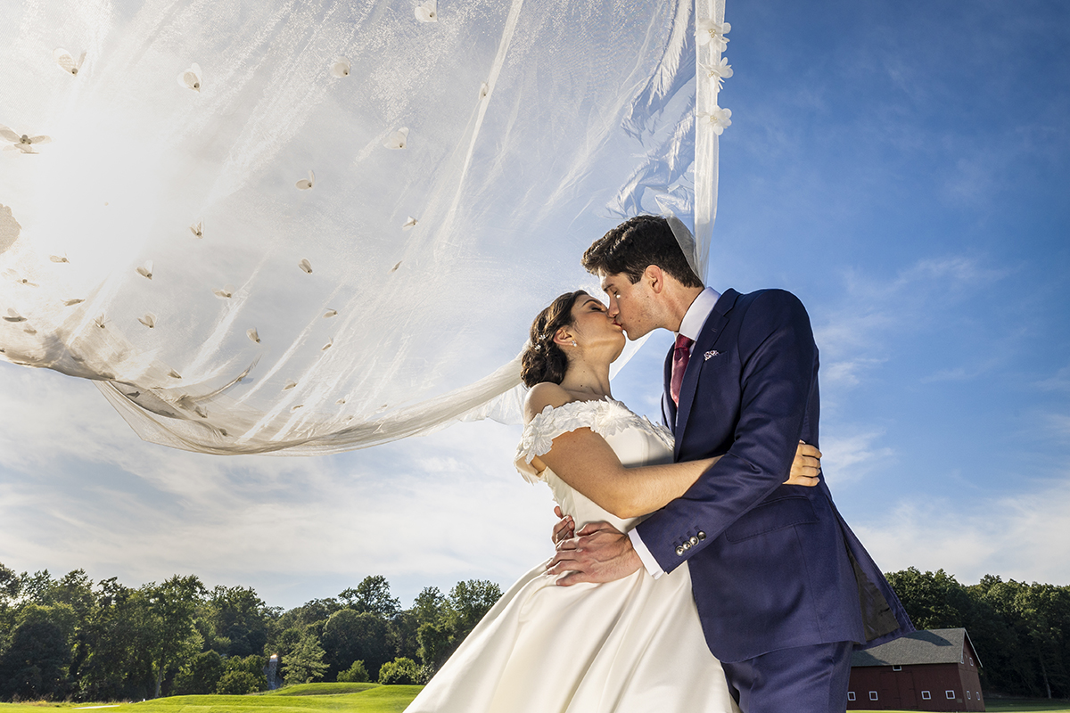 Classic wedding couple bride groom portrait with the view romantically blowing in the wind by Peter Oberc Wedding Photography in Westchester County New York