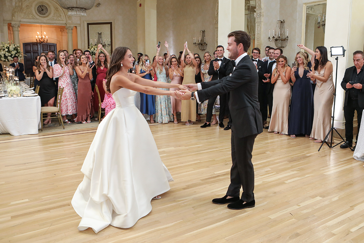 Photojournalistic candid wedding photo of a bride and groom grand entrance first dance at Westchester Country Club in Rye New York by Peter Oberc Wedding Photography
