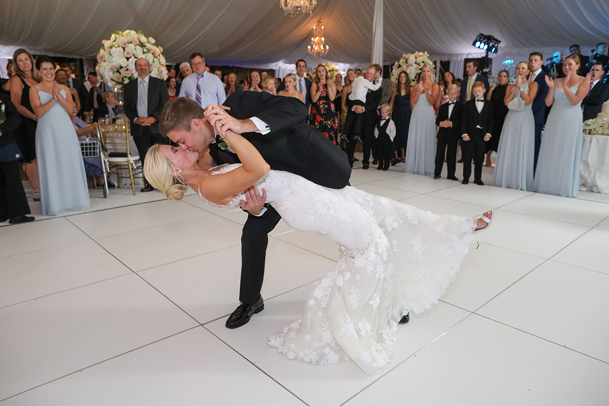 Photojournalistic candid wedding photography of a bride and groom first dance dip at Westchester Country Club in Rye New York by Peter Oberc