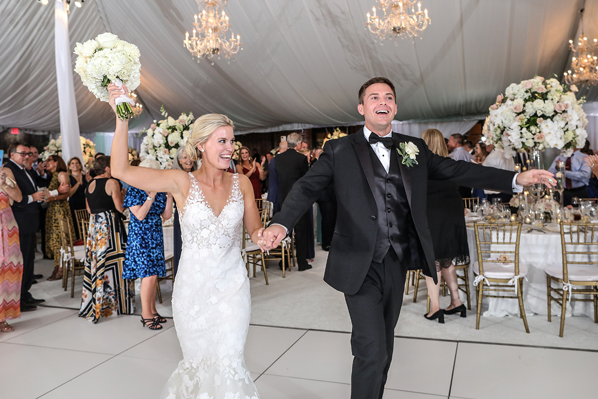 Photojournalistic candid photography of a bride and groom grand entrance for the first dance at Westchester Country Club in Rye New York by Peter Oberc